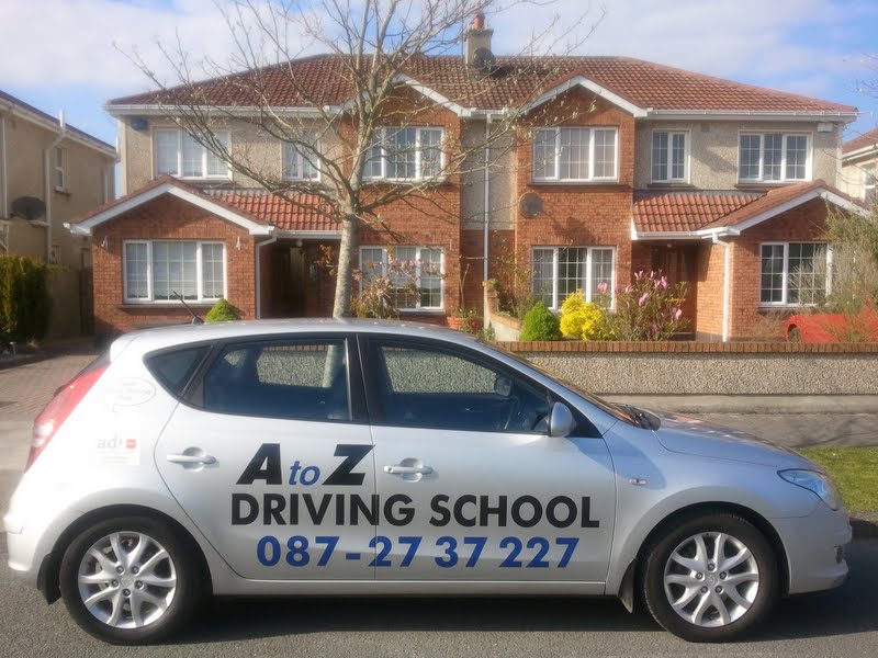 A to Z Driving School car parked outside a Dublin 15 house, offering driving lessons.