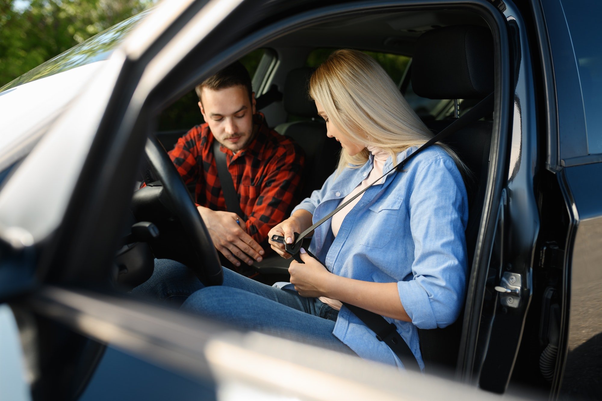 A to Z Driving School: Learner driver fastening her seatbelt in the dual control car.